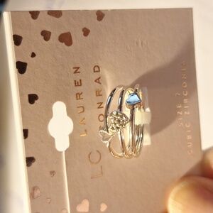 NWT LC Lauren Conrad cubic zirconia silver tone 3 ring sets, each w/a heart sz 7